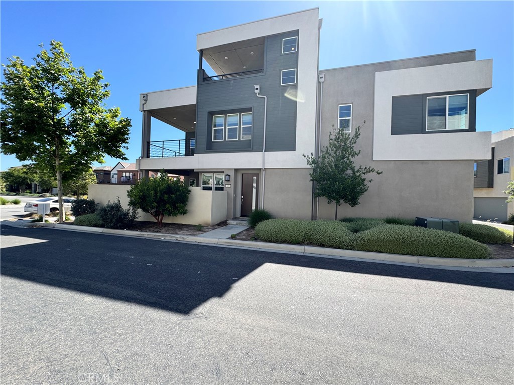 Stunning Detached Corner Lot Home with a View and a backyard! This spacious three-story home features three large bedrooms with large windows, two and a half bathrooms, an airy loft space, a third floor bonus room, and a two-bay garage. Enter into the dedicated dining room, which seamlessly opens into the family room and gourmet kitchen featuring large center island and walk-in pantry. Sliding glass doors off the dining room give access to a lovely California Room paved with new hardwood floors. The second floor offers two secondary bedrooms, a full bath, fun loft space for multiple uses, and laundry room. Off the loft is the spacious owner's suite and en suite bathroom showcasing an over sized walk-in closet with shoe rack, walk-in shower, separate soaking tub, and double sinks. On the third floor, a flexible bonus room lends itself for in-home office or entertaining with the covered deck and built-in cabinetry with included under counter beverage center. There is a large deck on each of the second and third floors. Zoned for top-rated Irvine Unified Schools, this almost new home offers the perfect blend of style, comfort, and convenience and includes access to all of the wonderful amenities that the Great Park Neighborhoods have to offer such as pools, playgrounds, BBQs, clubhouses and more. 5 minutes’ walk to the Olympic length swimming pool and 200 yards to Great Park. Walking distance to K-12 schools. Short drive distance to Irvine Spectrum Shopping Center. Ample guest parking spaces off the street.