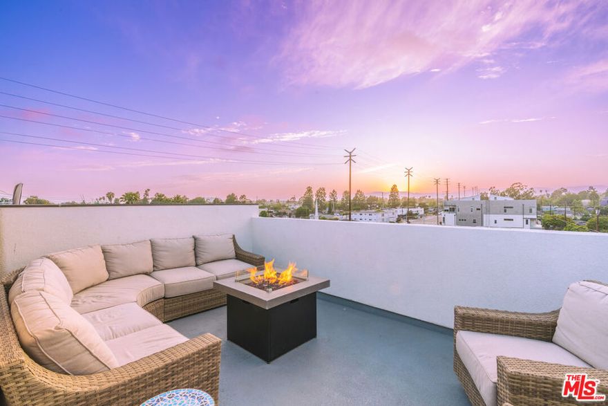 Welcome to a sleek, sunlit retreat in one of LA's most sought-after neighborhoods. This newer constructed 3-bedroom, 3.5-bath single family home blends smart design with luxurious comfort across approximately 2,000 square feet of thoughtfully crafted space with no shared walls. Step inside to soaring ceilings, clean lines, and a seamless open layout perfect for entertaining. The designer kitchen features quartz countertops, soft-close cabinetry, ample storage, elegant under cabinet lighting and high-end stainless steel appliances all opening to a bright living space with plenty of natural light. The primary suite is a true escape on its own floor, with a spa-inspired bathroom, including a large wet room, soaking tub, oversized dual vanity and walk-in closet that checks every box. Each of the 2 additional spacious bedrooms has its own en-suite bathroom and walk-in closet offering privacy, versatility and comfort.  The primary suite leads to your own private rooftop deck which includes a flat screen television - an entertainer's dream with panoramic city views and space to dine, lounge, and unwind under the stars.  Additionally, this home offers a second patio, EV-ready 2-car garage, tri-zone HVAC, high-speed wired internet, laundry room, recessed and bathroom mirrors with LED lighting, a tankless water heater, and gated garage and entry.  All of this just minutes from Playa Vista, Venice Beach, Mar Vista, Culver City, Marina del Rey, LAX, the beach and top-tier restaurants, shops, and parks.