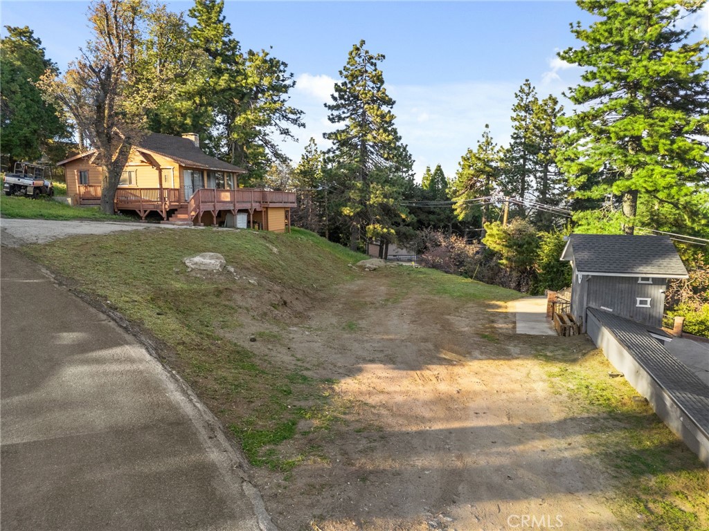 An exceptional opportunity awaits with this beautiful vacant lot located right next to a quiet, elevated neighborhood, this build-ready parcel offers breathtaking panoramic views of the city below—perfect for your custom dream home or investment build. Enjoy unmatched Fourth of July firework displays from your future deck or living room, with clear sightlines to multiple city celebrations lighting up the skyline. Whether you’re looking to create a full-time residence, vacation retreat, or income-generating property, this lot offers location, views, and potential all in one. Utilities are nearby, and the land is ideally positioned for a seamless construction process. Don’t miss your chance to secure a piece of one of Crestline’s most desirable streets.