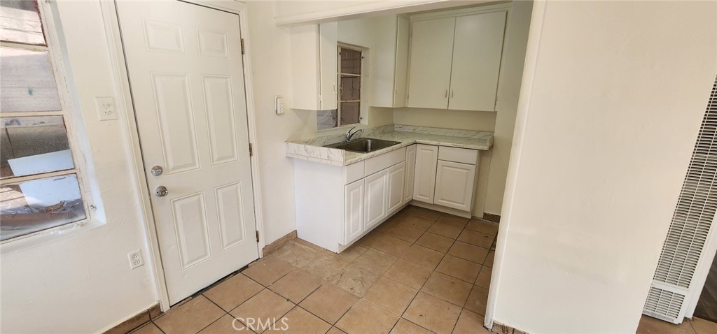 This wonderful spacious unit is ready for a quick move in. The unit features brand new kitchen cabinets, remodeled bathroom, large bedroom, spacious dining and living area. The unit is not attached to any other unit and has its own carport, storage area as well as washer and dryer hook ups. This unit will not last.