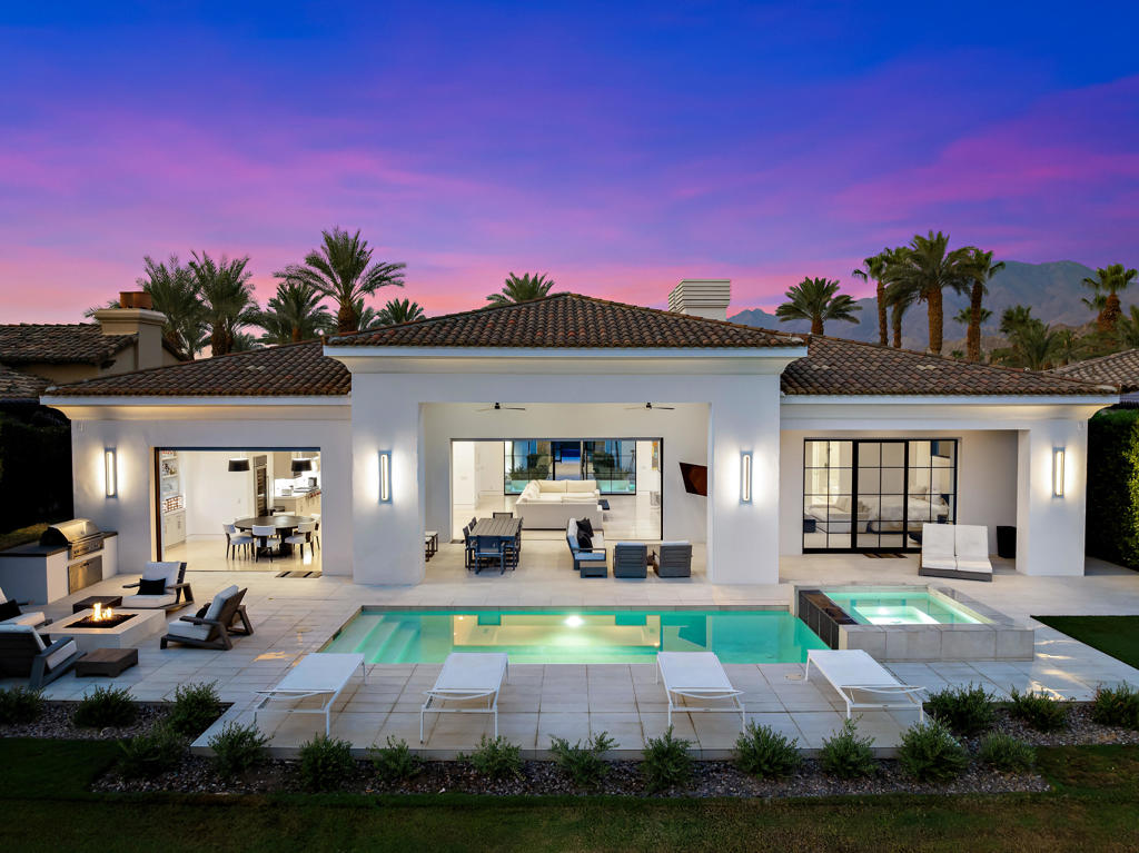 Stunning, modern custom estate at the Hideaway! Four bedrooms, four and a half baths, approx. 4,000 sq. ft. on .29 acre lot. Impressive courtyard entry with double fountains, great room with linear fireplace and gourmet stainless kitchen with center island / counter bar, wine display refrigerator, walk in pantry and breakfast room. Primary suite with fireplace and spa inspired bath. Pocket doors open to wonderful loggia, BBQ center, custom pool with raised spa and custom fire pit. Beautiful lake views on the 9th fairway of the Pete Dye course! Offered furnished per inventory, Art excluded. Buyer's purchase of Hideaway Golf Club membership is mandatory.