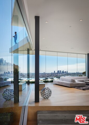A trophy modern in a world class location, designed by world renowned Belzberg Architects, and reimagined by JSN Studio. Rising up from one of the last great promontory sites on the Sunset Strip, this one of a kind contemporary offers Explosive views spanning Downtown Los Angeles to Century City and the Pacific Ocean beyond. Located one minute from the Sunset Strip & legendary Hollywood establishments such as Chateau Marmont and The Sunset Tower Hotel along with the new flagship Fred Segal store, Equinox Fitness and all of the finest dining Sunset Plaza has to offer. A minimalist but warm material palette is displayed throughout the interiors. A design that cannot be replicated under current planning laws, this exquisite home features five bedrooms, zero edge infinity pool, gym, theater, climate controlled wine room and rare off street parking for seven cars. Location, Architecture & Views - Live above it all. Shown to Pre-Qualified Buyers Only.