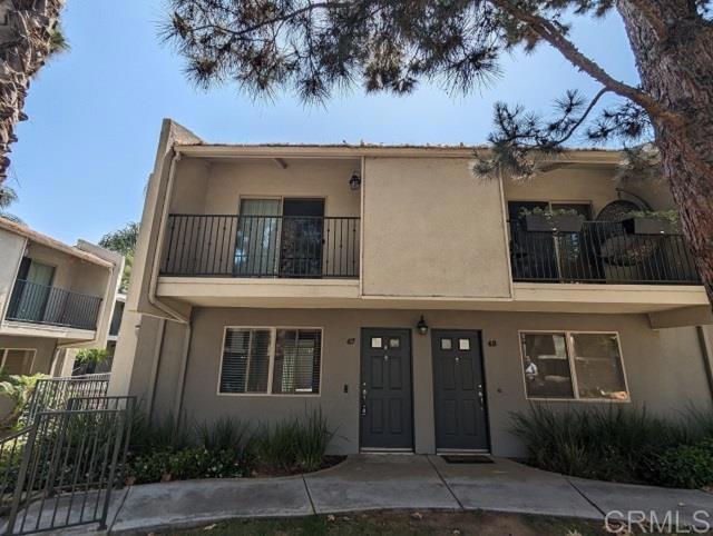 Discover this hidden gem in the The Village Townhomes community. This exceptional end unit only has one shared wall. Features include vinyl plank flooring in the living room, kitchen, dining and half bathroom on the main floor. The upstairs hallway and bedrooms are carpeted, for added comfort. Kitchen has stainless steel appliances, including a refrigerator, electric stove, microwave and dishwasher for easy cooking and clean-up. Two large bedrooms upstairs with the front bedroom offering a view of the courtyard and picnic area from the private balcony. Convenient laundry with full size washer and dryer in unit. Sliding door in dining room opens up to the private fenced back patio, ideal for entertaining guests. Complex features a pool, exercise room, picnic area, and 1-assigned, covered parking space for peace of mind after a long day. Centrally located near shopping, dining, and freeway access and public transportation. Don't miss out on the opportunity to call this great townhouse your next home!