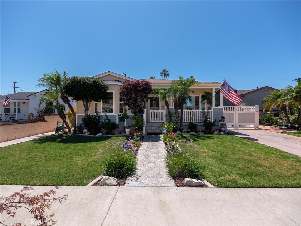 Welcome to this beautifully maintained 4 bedroom, 3 bath home located in the highly sought-after El Camino Village. Offering approximately 1,700 sq.ft. of living space on a generous 5,800 sq.ft. lot, this property combines charm, functionality, and modern upgrades in one exceptional package. The curb appeal is instantly inviting with its flagstone-accented front, turf landscaping for low maintenance, and a cozy front porch—perfect for enjoying your morning coffee or tea. Step inside to an expansive, open floor plan where the living room features a fireplace with custom granite finish and multiple windows that fill the space with natural light. The home includes two main suites, each with its own private bath. The front bedroom suite offers convenience and privacy, while the rear suite—the largest—opens to the backyard through sliding doors. A large bay window gives the front suite classic charm, and the short hallway is outfitted with thicker walls to provide extra noise dampening and adding comfort to the space. The dining area flows seamlessly into a breakfast nook and updated kitchen, complete with tile flooring, granite countertops, and refinished hardwood cabinetry. Original hardwood floors throughout the home add timeless character. The backyard is a true retreat, boasting a covered patio with flagstone accents, a Sundance spa, Trex decking, and a custom-built BBQ station with ample counter space and electrical connections for rotisserie or appliances. The extra-large garage and attached workshop (approx. 800 sq.ft.) provide abundant storage, room for projects, or the potential for an ADU conversion. Additional upgrades include: Newer roof (approx. 3 years old) with seamless gutters, vinyl windows and doors throughout, copper plumbing throughout, 220V electrical panel & full rewire (2003), central heat & air conditioning, tankless water heater, custom lot drainage system, extra-long driveway—ideal for RV or boat (or both!) parking, vinyl gates, patio, and gazebo covers, and the list goes on! Perfectly located near Alondra Park, El Camino College, Mark Twain Elementary, shopping, dining, major highways, and just 5 miles from the beach, this home checks all the boxes for comfort, convenience, and lifestyle. Don’t miss your chance to own this meticulously cared-for home in El Camino Village!
