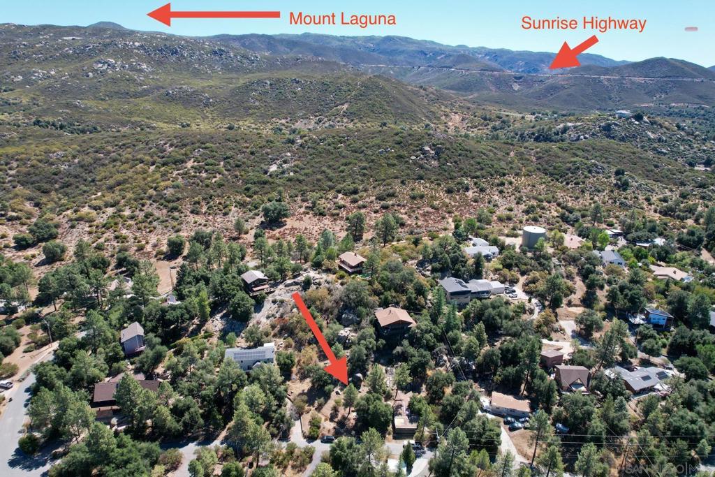 Just under a ½ acre vacant lot in Pine Valley. The lot has large boulders and oak trees on it. It has had a septic layout done for a 1 bedroom home, perc test, and survey. One street away from the Cleveland National Forest, 15 minutes from Mount Laguna, 35 from Julian and Lake Cuyamaca. You are close to some of the best recreation San Diego has to offer. Right from this property you can ride horses, mountain bike and hike into the mountains. This lot has a water meter installed and there is power across the street. Next to 8141 Pine Blvd.