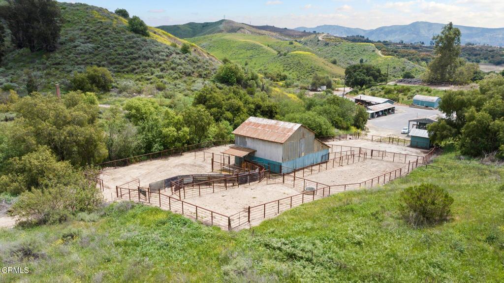 Presenting an exceptional investment opportunity to acquire a substantial landholding located near Ojai, Cities of Ventura and Santa Paula in Ventura County. Encompassing approximately 858 acres (1.3 square miles but feels like 2), this expansive and fully usable property offers a unique blend of nature, privacy, accessibility, and long-term potential. Property of this size rarely becomes available in Ventura County.Strategically positioned in a secluded yet convenient location, the property is comprised of three different legal parcels with established paved electric gated access, city water, electricity, and utility easements. It also includes 10-acre feet of valuable adjudicated groundwater rights via a shared well, making it well-suited for up to 3 homestead parcels or livestock use. Not currently in Williamson Act and without any conservation easements, buyer to verify.With approximately 3,000 linear feet of shared boundary with the City of Santa Paula, the property has a history for possible future annexation or development. Previously considered for residential use, a comprehensive file of development studies--including a full Environmental Impact Report--is available for review at the Broker's office. Originally known as a part of the Fagen Canyon Project.This offering is ideal for investors seeking a 1031 exchange, land banking opportunity, or conservation-focused acquisition. The land features a desirable mild Mediterranean climate influenced by nearby coastal weather, along with a picturesque landscape of level terrain, gently rolling hills, and ocean-view ridgelines.Miles of internal trails and dirt roads provide full access across the property. Additional improvements include cross fencing and multiple auto-fill water troughs, supporting a variety of agricultural or recreational uses.Recently reduced and ready for sale to a new custodian of the land, this rare offering must be seen to be fully appreciated in its scope, natural beauty, and future potential. Wildlife in abundance along with two seasonal reservoirs and creek enhance the property also. A perfect setting for a grand estate.