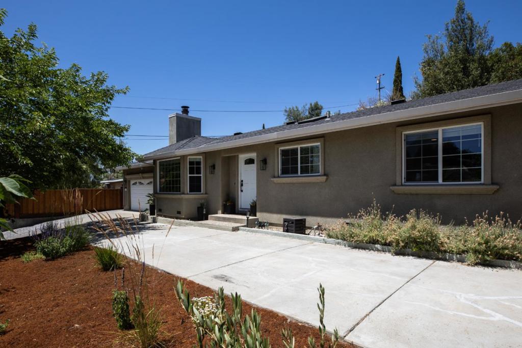 Beautiful single level home nestled up against the foothills, minutes away from the hustle and bustle of the Silicon Valley. Updated kitchen with granite countertops, center island with sealed concrete countertops, high-end stainless steel appliances, wine fridge and loads of storage. Kitchen opens up to the dining area and living area with cozy fireplace, ideal for get-togethers with family and friends. Skylights (with shade covers) throughout the home provide abundant natural light. Both bathrooms were remodeled just a few years ago with stylish tile flooring and elegant finishes. Some of the exterior updates include a retaining wall, new fencing, turf, fully landscaped front/ side yards, including a fire pit area and covered outdoor dining area with string lights, drainage upgrades and Rachio automatic sprinkler system. Some of the interior updates include a new heat pump, attic fan, fans in bedrooms, electrical upgrades, new blinds and sun shades, Nest thermostat and new closet system in guest room. Electrical for EV charger(Level 2, 240 Volts) in garage too! This home is located on the quiet part of Story Road as it curves up along the foothills (not the 4-lane part of Story Rd.) Don't miss this hidden gem!