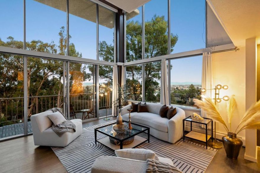 Spectacular and rare mid-century modern inspired loft condo featuring dramatic architecture, expansive volume, and stunning natural light. This beautifully updated 3-bedroom, 3-bath home offers approximately 1,800 sq ft of open living space, highlighted by 20-foot floor-to-ceiling windows showcasing breathtaking views of the San Francisco skyline. Upgrades include fresh interior paint, new modern light fixtures, quartz countertops, stainless-steel appliances, remodeled bathrooms and a cozy fireplace. An open-concept layout creates a seamless flow throughout the main living areas. Located in a highly desirable Belmont neighborhood, the community offers exceptional amenities: 2 designated parking spots along with additional storage, swimming pools, spas, fitness center, billiards room, library, two elevators, underground parking, peaceful courtyards, and the impressive Sky Room with panoramic views. Prime location close to restaurants, shopping, Caltrain, parks, and major commute routes to both San Francisco and Silicon Valley. Enjoy access to top-rated Belmont schools.