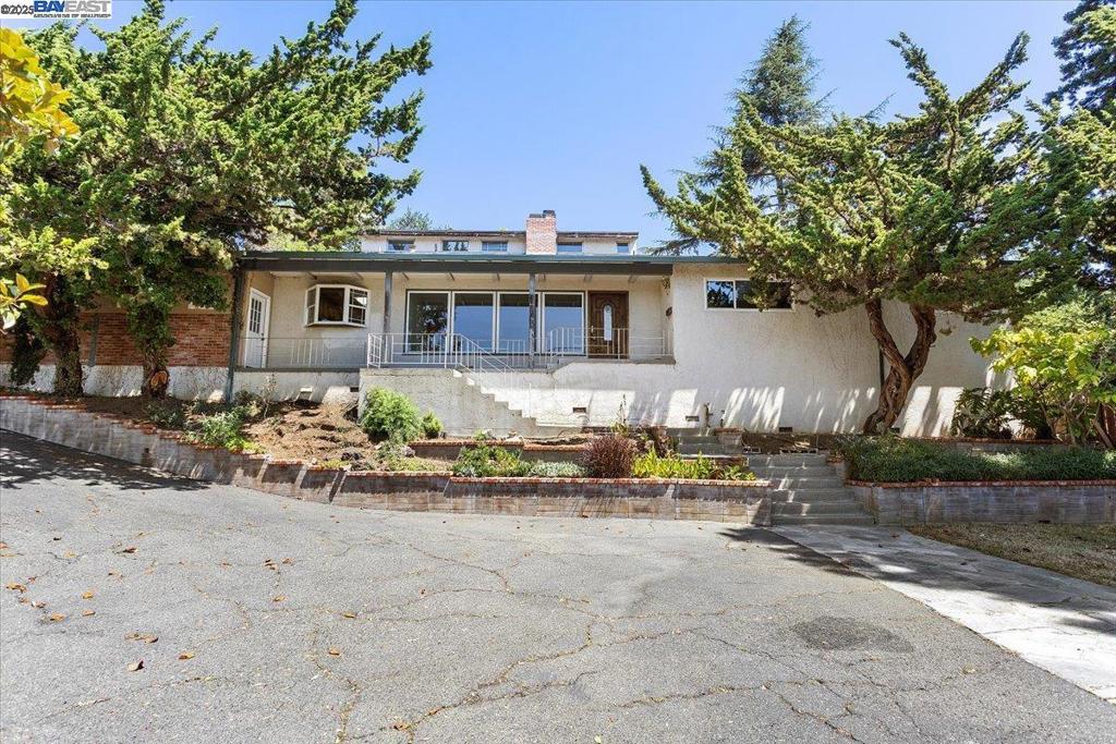 Discover endless potential in this custom-built 5-bedroom, 3.5-bathroom home set on an impressive 17,000+ sq ft lot in the heart of Castro Valley. Tucked away in a serene and private setting just off Lake Chabot Road, this nearly 3,000 sq ft residence offers beautiful views and the rare opportunity to live close to Lake Chabot—ideal for hiking, biking, and enjoying the great outdoors. Inside, enjoy sun-drenched spaces with skylights, elegant Canadian maple flooring, and a built-in desk area perfect for remote professionals. The thoughtfully designed layout includes an attached 2-car garage (featuring extra storage in the garage), plus a versatile storage shed out front—ideal for an art studio, workshop, or creative retreat. A charming outdoor seating area creates the perfect space for entertaining or quiet evenings under the stars. Located within the highly sought-after Castro Valley School District, this property blends natural beauty and suburban convenience close to freeways and BART. Don’t miss this unique chance to own a peaceful slice of Castro Valley charm!