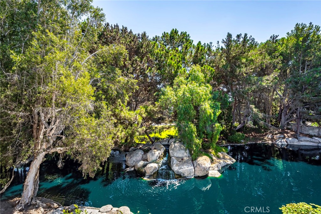 This is the one you have been waiting for with endless views of the lagoon in the back and amazing views of the park in the front! Hands down the best views in all of Seabridge! This beautifully upgraded condo will wow you when you first walk through the door you are greeted with a 12 ft high soaring stack stone fireplace with a custom reclaimed wood wrap around mantle. The open concept large great room features cathedral ceilings and tons of natural light. The updated kitchen boasts of white shaker cabinets with an added pantry, granite countertops, farmhouse sink and stainless-steel appliances. You also have space for a large dining room table that overlooks the lagoon. Step outside onto the deck to enjoy your coffee or cocktails while you sit back and relax to the sound of the waterfalls. Back inside you will find a primary bedroom with beautiful views of the park, vaulted ceiling, and an ensuite bathroom with white shaker cabinets, granite countertops, dual sinks, an extended shower and skylight. The secondary bedroom, which also enjoys view of the park, has a brand-new queen-size murphy bed making it a great flex space that can be used as an office or workout room or whatever you need! There is a spacious second full bathroom with tub. You will also appreciate that this condo has all new windows and sliders, whole house attic fan plus air conditioning so you will be ready for those warm summer nights. There is also an inside laundry with stackable washer and dryer, luxury vinyl flooring throughout, and custom closets. We used company brand names you can trust - Kohler, Delta, Rheem, Ring, WeMo, York, Milgard, COREtec, Hunter, Chamberlain, Samsung, LG, closets by design and Quietcool. All kitchen appliances, stackable washer and dryer and queen murphy bed are included in the sale. You also get a one car detached garage that features custom cabinets along with high loft racks for additional storage.
Seabridge Village offers 24-hour guard gates, 4 tennis courts, 4 community pools, 4 jacuzzies, clubhouse, and plenty of green space and walking paths for you and your pets! HOA includes water and trash. Just a short bike ride to the beach! Don’t miss out on this amazing opportunity to live the beach life! Everything has been done for you. You just need to move in!