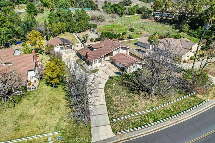 Rare Dual-Home Estate in Prestigious “The Country” Community.  Welcome to 22517 Lazy Meadow Drive, a truly unique estate nestled within the exclusive Diamond Bar “The Country” Association. This exceptional property sits on approximately one acre of rare, mostly flat land and features two separate homes—a rare find in this sought-after neighborhood.



Main House:

• 3,522 sq. ft. of living space

• 4 bedrooms, 3 bathrooms

• Spacious three-car garage

• Expansive deck off the main bedroom

• Large covered patio—perfect for outdoor entertaining

• Pool (currently covered and not in use)



Guest House (Built in 2004):

• 1,120 sq. ft. of well-designed living space

• 1 bedroom, 1 bathroom

• Comfortable living and dining areas

• Fully equipped kitchen

• Laundry closet

• Private one-car garage



Located within walking distance to the community clubhouse, HOA pool, tennis courts, pickle ball courts, and horse stables, this property offers unparalleled access to top-tier amenities. Conveniently positioned near the 57 and 60 freeways, it provides easy access to Orange County, Los Angeles, and San Bernardino.  Highly-Rated Diamond Bar schools.  Properties like this—a nearly flat acre lot with a long driveway and two homes on-site—rarely become available in The Country. Don’t miss this incredible opportunity to own a one-of-a-kind estate in one of Diamond Bar’s most prestigious communities!