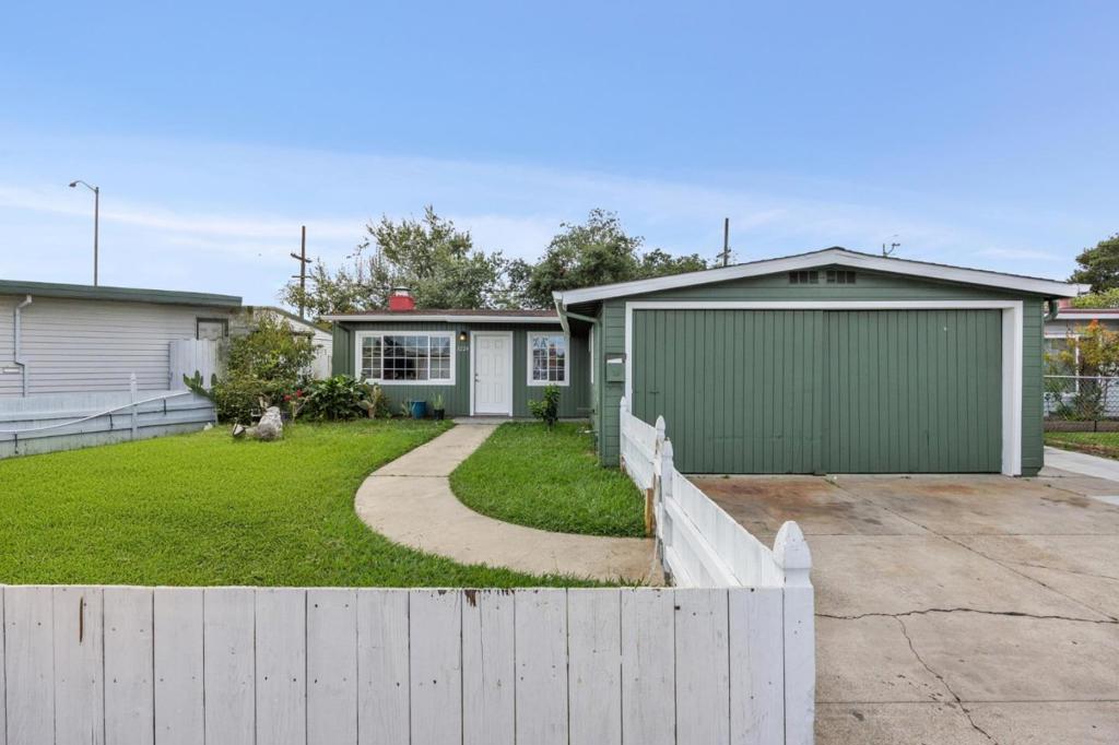 Welcome to 1224 Norton Street, a beautifully remodeled home offering style, comfort, and functionality 3 Bedrooms, 1 bathroom plus a Bonus Room converted garage to use as a bonus bedroom or hobby room. Updated in 2024, this residence features a bright and inviting kitchen with sleek quartz countertops, newer appliances, and modern finishes. The open layout is enhanced by laminate flooring throughout and recessed lights, while double-pane windows fill the home with natural light. Enjoy spacious bedrooms for restful retreats and a cozy wood-burning fireplace in the living room that creates the perfect ambiance for gatherings. Laundry room with Samsung washer and dryer. The expansive backyard and large side yard provide endless possibilities for entertaining, gardening, or future expansion. With a driveway that accommodates up to three vehicles, this home combines convenience with charm. Don't miss the opportunity to own this move-in-ready gem! Easy access to downtown San Mateo shops & restaurants, easy access to freeway for commute to hi tech companies!