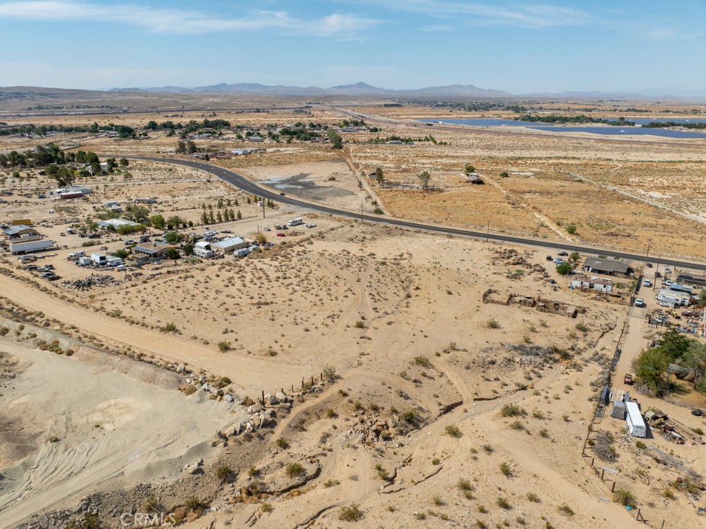 @@@Room to Roam@@@Direct frontage on Old Hwy 58 with road access in the back to Neuman St. This beautiful lot is only a few miles to downtown Barstow and everything you need. Power lines are right in front of the lot while private well and septic tank are necessary and common in the area. This lot is in San Bernardino County jurisdiction and zoned RL-5 (Rural Living-5 Acre Minimum) which allows for single family homes and incidental agriculture uses. This is really an unique opportunity to enjoy a peaceful desert lifestyle with expansive open spaces and breathtaking natural beauty. With BNSF Railway’s B.I.G. Project (Barstow International Gateway) on the way, the city is embracing unprecedented growth. Do not miss this opportunity to make your dream come true on this blank canvas. Please note that the boundaries represented in the photos are only an estimation. Address has been assigned by the county.