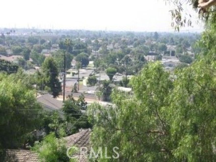 Located in the desirable Olive Heights neighborhood near Eisenhower Park, this spacious property offers a rare multi-unit opportunity in the City of Orange. The upper level features a large four-bedroom home with generous living spaces and updated finishes, while the lower level includes a well-appointed two-bedroom apartment or guest quarters—ideal for extended living or additional rental income. The property includes two separate garages: a three-car garage for the upper residence and a detached two-plus-car garage for the lower unit, providing ample parking and storage. Recent improvements include refreshed interior and exterior updates, landscaping enhancements, and ongoing exterior painting. Conveniently located near parks, shopping, and major freeways, this property combines versatility, comfort, and an excellent Orange County location. Tenants pay all utilities. Located between the 91 and 55 freeway. Will not finance. Must obtain new loan. AS IS, WHERE IS.