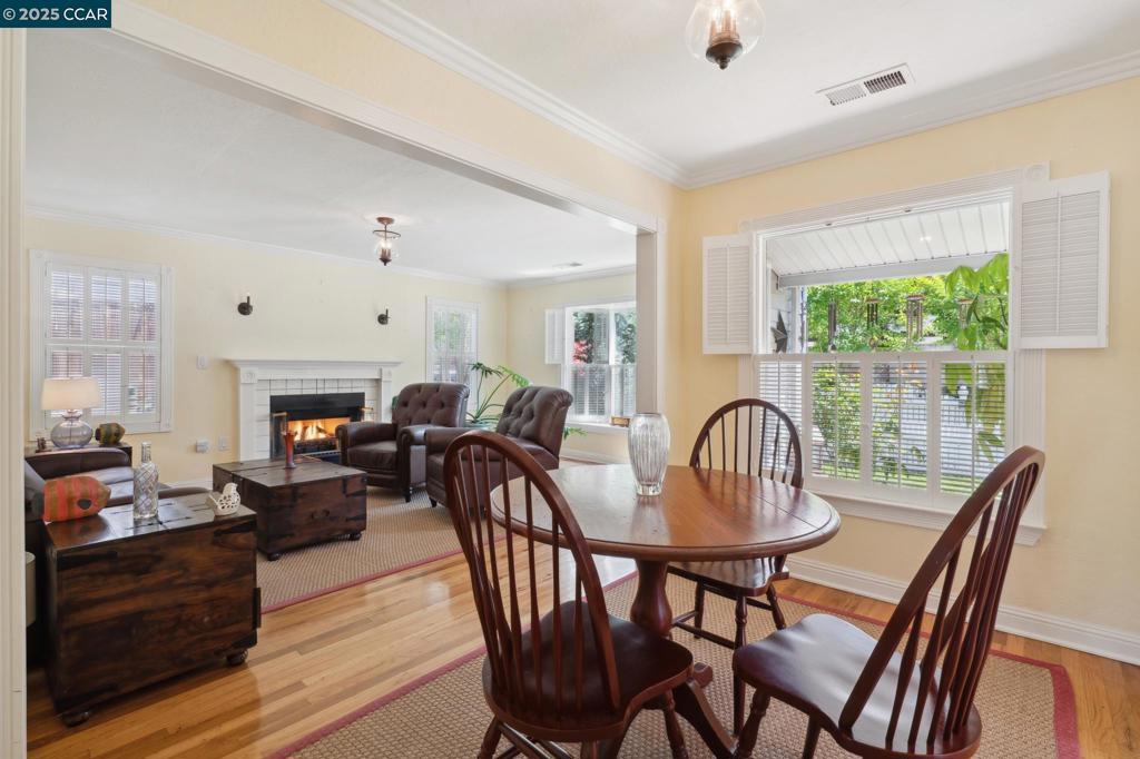 This stunning 3-bed, 2-bath bungalow in the heart of Martinez seamlessly blends vintage character with top-to-bottom modern upgrades—every inch thoughtfully reimagined since 2011. Nestled on a beautifully landscaped 4,500 sq. ft. lot with no front neighbors, this 1,160 sq. ft. gem offers comfort, charm, and exceptional convenience just moments from Alhambra High School, local shops, and cozy cafés. Custom pale pastel yellow maple cabinetry, brand-new Café gas range with dedicated gas line and matching hood, stylish vent cover, John Boos butcher block counters, and hand-painted Walker Zanger tile backsplash. A deep farmhouse sink, drawer microwave, and designer lighting complete the space. Relax in a Randolph Morris clawfoot tub under a Le Claw phone shower system and curtain ring. Timeless finishes, classic tilework, and spa-level serenity throughout. New bedroom, bathroom, and laundry room doors, dual-pane windows with San Francisco wood café shutters, cozy gas fireplace, and refinished hardwood floors. Rich crown molding and brand-new baseboards bring warmth and detail to every room. AC system runs like new. Major improvements include a new roof installed in 2012, a new 3-car driveway, upgraded gate and fencing, beautiful bay window, and elegant light fixtures inside and ou