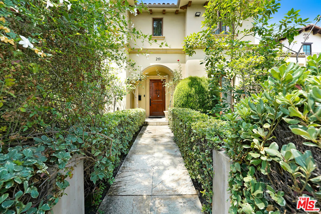 Architectural Mediterranean Villa with 2-levels of exquisite living & entertaining areas in desirable Beverly Hills. The gated villa features a great for entertaining open floor plan with living & dining areas, family rooms with fireplace, grand chef's kitchen with high end appliances, large center island with breakfast bar and a separate breakfast nook all with access to the stunning backyard. Step outside to a sparkling swimming pool, a spacious patio with a shaded pergola, and beautifully landscape greenery that creates a private oasis, perfect for lounging or hosing gatherings. Also, the main floor features a bedroom suite and a separate library/office and a guest's powder room. The second floor features 4 bedroom suites, including a master suite with dual walk-in closets and dual luxurious bathrooms and a side by side washer and dryer with cabinetry. Prime location of Beverly Hills close to La Cienega Tennis Center with 16 courts and La Cienega Park and all the top restaurants and most famous shopping streets. Enjoy the Beverly Hills Lifestyle!