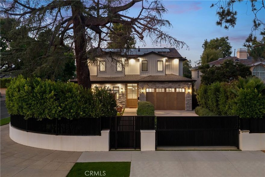 Nestled in the coveted Chandler Estates neighborhood of Sherman Oaks, this newer construction home sits on a gated corner lot, strategically setback from the street to create a private oasis. Designed for modern living, the spacious open-concept main level is anchored by a show-stopping chef’s kitchen equipped with top-of-the-line JennAir appliances and a massive island with seating. Floor-to-ceiling sliding glass doors in both the living room and formal dining room open seamlessly to the backyard, effortlessly extending your living space outside. Step outside to a serene retreat surrounded by mature privacy hedges and highlighted by a heated pool/spa, plus a built-in BBQ with bar seating – the ideal space to entertain or unwind after a long day. The gated front yard also impresses with a built-in fire pit and putting green. Upstairs, four generously sized ensuite bedrooms ensure everyone has their own private retreat, while a dedicated laundry room offers convenience. The sophisticated primary suite features a private balcony, custom walk-in closet and spa-inspired bathroom, complete with a soaking tub, oversized rainfall shower and double vanity. Additional highlights include a main-level ensuite bedroom, high ceilings throughout,  water softener system, reverse osmosis with instant hot water and added alkaline, a two-car garage with an EV charger outlet and smart home system with built-in speakers, security cameras, a Nest thermostat and more. Ideally located just moments from Westfield Fashion Square, Ventura Boulevard’s premier shopping and dining, and top private schools including Notre Dame, Harvard-Westlake, and Campbell Hall.