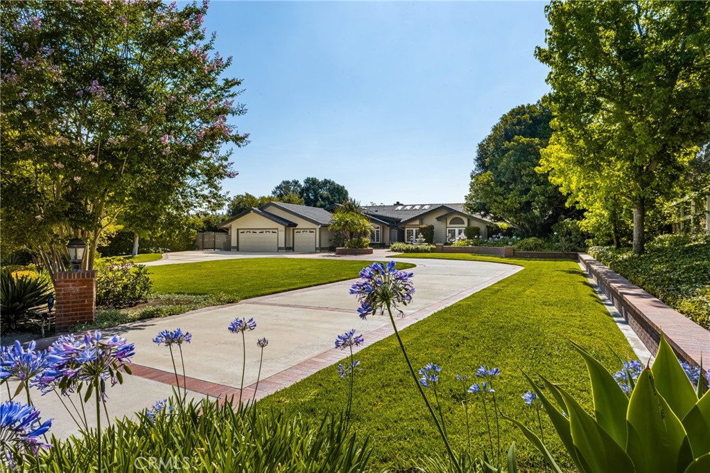 Highy sought after single-story estate situated on a nearly flat 1 acre parcel in Orange Park Acres. Experience the unparalleled amenities with this 6,433 sq ft estate, where resort-style living meets ultimate comfort—all on a single level. This exceptional property boasts 6 spacious bedrooms, of which 5 are en-suite, ensuring privacy and convenience for all residents and guests. The primary suite with impressive walk-in closet, provides a serene getaway with oversized soaking tub, comfortable retreat with fireplace, refrigerator, and access to the backyard resort. Step inside to discover an expansive floor plan designed for both relaxed living and entertaining on a grand scale. The gourmet kitchen is a chef's dream, featuring four ovens, abundant counter space, walk-in and butler’s pantries, and seamlessly flows into the formal dining area. Additional highlights include an expansive family room, creating endless options for relaxation and entertainment, a dedicated home office, home gym, and a temperature controlled walk-in wine cellar that caters to the most discerning connoisseurs. The indoor spaces effortlessly transition to your private backyard oasis, perfect for outdoor gatherings or simply relaxing. Enjoy a lighted regulation-size tennis court (or perhaps pickle ball?), a sparkling swimming pool, and a fully equipped outdoor BBQ kitchen, all complemented by multiple seating areas that invite relaxation and enjoyment. Nestled in the prestigious equestrian community of Lazy Creek Country Ranch Estates. Residents enjoy direct access to 25 miles of equestrian trails, making this home an ideal retreat for horse enthusiasts. Additionally, this remarkable home further offers a Tesla charging station and circular driveway providing off street parking for up to 10 cars! This rare offering combines luxury, privacy, and functionality, perfectly catering to discerning buyers who value space, style, and sophistication. Your opportunity of a lifestyle awaits!