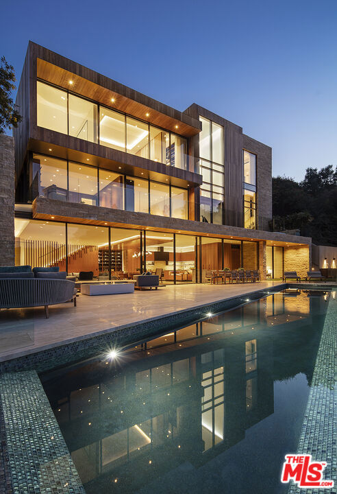 The Ultimate in California Lifestyle. Exceptional Modern Jewel in the heart of prime Pacific Palisades Riviera. Recently built by Tyler Construction using the highest quality materials, executed to a standard that is on par with world-class museums. Wood, steel, stone come together in a warm and timeless design. Interiors by James Magni and architecture by Russell Shubin. Over 7,700sqft of impeccable detail. Elements include: floating walnut staircase, limestone throughout and slatted Afromosia wood. 5 bedrooms, 7 baths. Primary suite is a world apart. Screening room with full bar. Incredible Gourmet kitchen adjacent to vast great room walls of glass open to infinity edge pool and beyond. Detached gym/guest suite with en suite, kitchenette and separate entrance. Offered fully furnished with the highest quality furniture and furnishings. A rare offering.