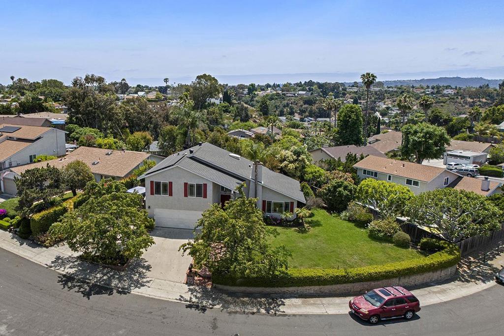 This gorgeous two-story home in the heart of University City offers a perfect blend of comfort, style, and convenience. Boasting 3 spacious bedrooms and 2.5 beautifully remodeled bathrooms, this 1,918 sq ft home is situated on a generous 6,200 sq ft lot. The light-filled living room features soaring vaulted ceilings and a cozy fireplace, creating a welcoming atmosphere. The chef’s kitchen is a dream, with sleek newer stainless steel appliances, including a gas range, and ample counter space. A separate family room with a built-in wet bar provides a great space for entertaining or relaxing. The dining room offers a perfect setting for meals with family and friends. Enjoy the benefits of fully paid-off solar electricity, making your home both eco-friendly and energy-efficient. The detached, insulated room offers endless possibilities — whether it’s a home office, playroom, or creative space, you can tailor it to fit your needs. The expansive front yard is perfect for outdoor activities, with plenty of space for kids and pets to play. The primary suite features a large walk-in closet and access to a newly updated deck, perfect for enjoying morning coffee or evening sunsets. This home is ideally located near excellent schools, a nearby park, and a wealth of local amenities. You’ll be just minutes from world-renowned shopping, restaurants, the UCSD campus, trolley stations, La Jolla beaches, and scenic hiking trails. All ultility wires are undergound! A truly exceptional opportunity — don’t miss out on this beautiful University City home!