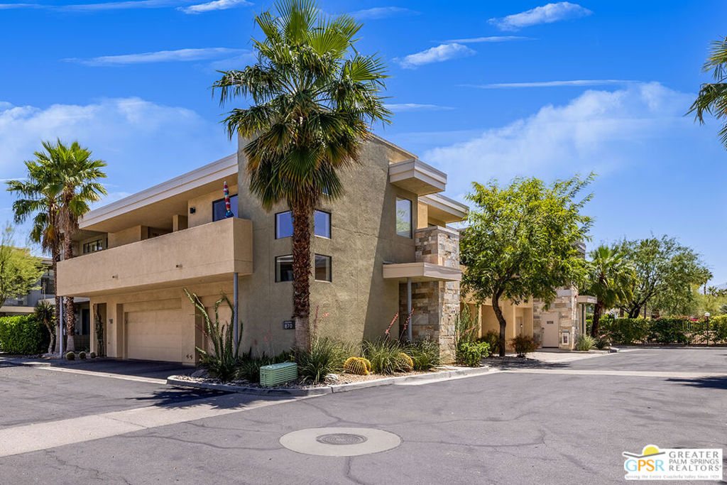 Welcome to Biltmore Colony South Palm Springs Living at Its Finest! Rarely available, this stunning two-story condo with a FOUR-CAR GARAGE in the highly desirable, gated community of Biltmore Colony offers a unique opportunity to own a piece of South Palm Springs on fee land - you own the land. Built in 2006, this move-in-ready home has been thoughtfully refreshed with new carpeting, stylish light fixtures, and a brand-new HVAC system for year-round comfort. The spacious living area and bedroom showcases direct mountain views, views, views! Remote-controlled Hunter Douglas shades and new ceiling fans are simply a few of the amenities and upgrades. The open-concept design seamlessly connects the living, dining, and kitchen spaces. The kitchen comes fully equipped with stainless steel appliances, plus a separate laundry room with full-sized washer and dryer. Step outside to your private patio with direct gorgeous mountain views. Did I mention views? The perfect spot to unwind or entertain. Upstairs, the primary suite boasts a walk-in closet and an updated bathroom with a new fan/ventilator. Parking is effortless with a rare FOUR-CAR garage for car parking, recreational vehicles or storage, complete with two brand-new garage door motors and remotes, plus additional guest parking within the community. Biltmore Colony residents enjoy resort-style amenities including a fitness center, clubhouse, outdoor barbecue areas, and three sparkling pools, cabanas and spas. Whether you're seeking a full-time residence or the ultimate desert getaway, this immaculate condo combines luxury, convenience, and low-maintenance living in one of Palm Springs' most coveted locations. Don't miss this rare opportunity to own a unique unit who shares the neighborhood with The Ace Hotel, Koffi South and several great restaurants and shopping in close proximity. This unit is sold furnished and is turnkey. Just bring your favorite wine and toothbrush. Schedule your showing today! (NOTE: More interior photos and amenities will be uploaded late Tuesday afternoon 8/26.)