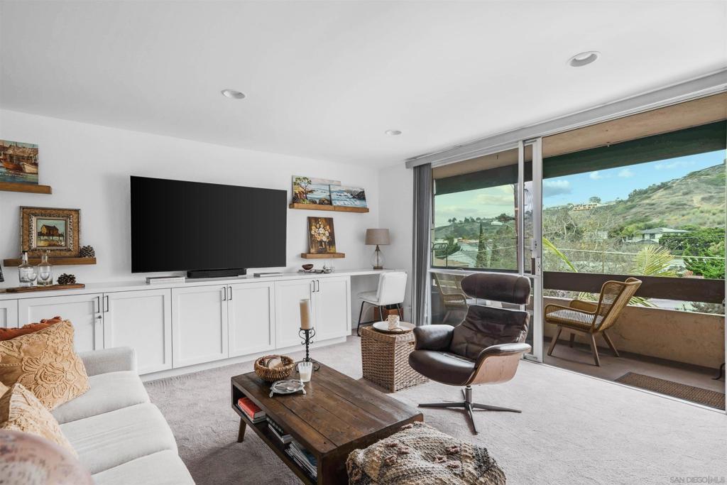 Live the La Jolla lifestyle just two blocks from iconic Windansea Beach in this rare, upgraded one-bedroom condo tucked inside the lush Villa La Jolla complex. This is one of the very few units with no neighbors on either side and it shows, it feels more like a private casita than a condo. Enjoy complete tranquility, away from street noise, with serene eastern views of green rolling hills from your private balcony. The interior is fully updated with a sunny open floor plan, recessed lighting and a warm, coastal-chic vibe throughout. This home offers convenience of a nearby elevator or stairs that are in close proximity to the assigned carport. Whether you're looking for a full-time coastal retreat or a weekend escape, this unit checks all the boxes: privacy, location, peacefulness, and walkability. Windansea sunsets, morning coffee on your private balcony, and La Jolla’s best just around the corner. This is the one.