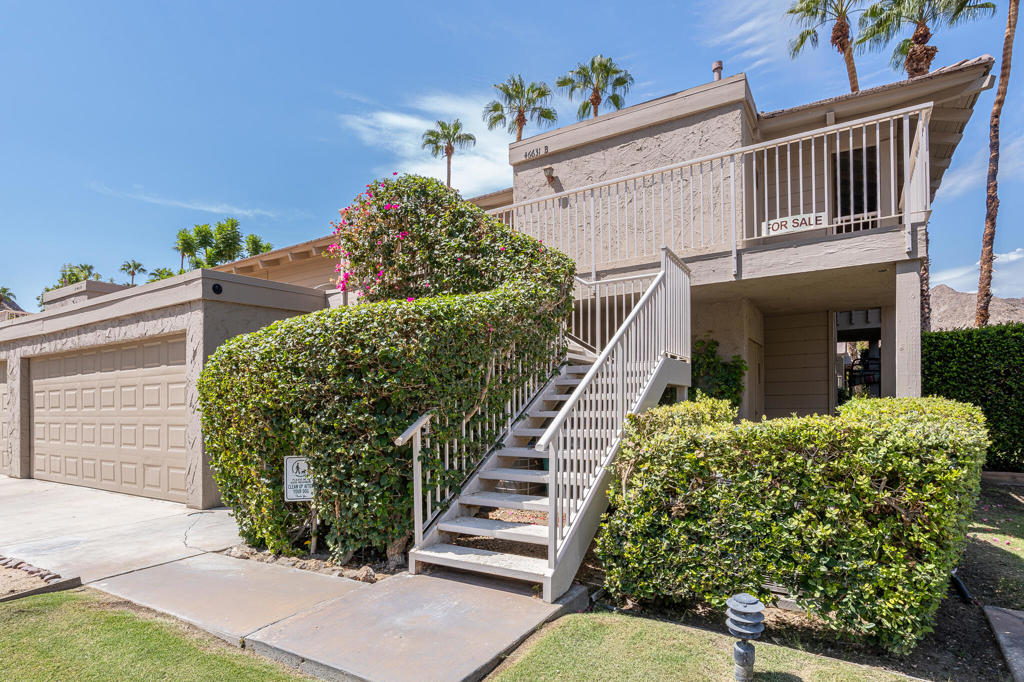Nestled in the quaint gated community of Mountain Cove, this 2 bed, 2 bath upper-level condo features an open floor plan with vaulted ceilings and three private balconies. Enjoy breathtaking southwest-facing mountain and sunset views from the main living area and balcony, while the front patio captures stunning sunrise views. Offered partially furnished, this home provides a comfortable move-in-ready opportunity with options for outdoor entertaining and relaxation.The spacious primary suite includes a walk-in closet, updated bath with dual vanity and custom-tiled shower, and a private balcony with pool and mountain views. The guest suite also has its own bath, making it ideal for visitors. Both bathrooms have been beautifully renovated with tile floors and quality finishes.With a 30- day minimum rental policy, this condo also offers excellent potential as a part-time residence with rental income while you're away. Located within the IID district, this community also gives Indian Wells homeowners access to special city resident discounts on golf, dining, and local amenities. Just minutes from world-class tennis, golf, shopping, and dining. Situated on lease land with expiration in 2069.