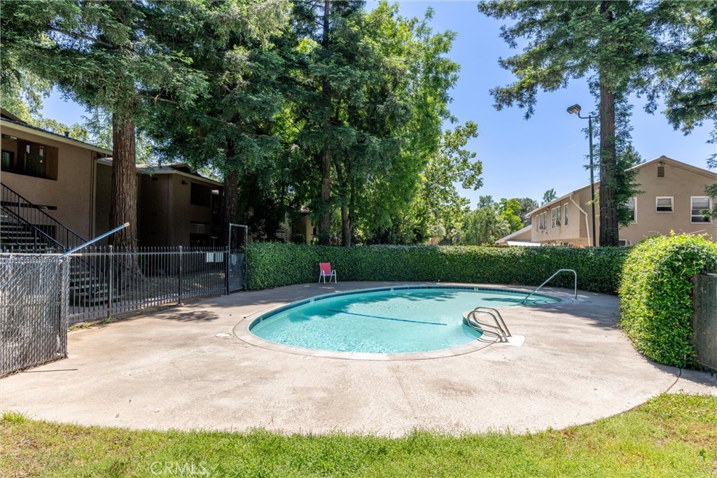 Welcome to Woodland Commons — a beautifully maintained gated community in Chico offering comfort, convenience, and lifestyle! This updated 3-bedroom, 2-bath upstairs condo features 960 square feet of thoughtfully designed living space. Step inside to find brand new carpet, fresh paint, new doors, and a bright open layout. The kitchen is equipped with granite countertops and stainless steel appliances. The private balcony just off the living area has a view of the sparkling pool — ideal for relaxing or enjoying your morning coffee. The condo includes a stackable washer and dryer, central HVAC, and a primary bedroom with en-suite bathroom for added privacy and ease. Enjoy low-maintenance living with an HOA that covers water, sewer, trash, building insurance, roof maintenance, landscaping, pool care, security gate, and parking lot upkeep. Don’t miss your chance to own this move-in-ready home in one of Chico’s most central locations. Schedule your private showing today and see all that Woodland Commons has to offer!