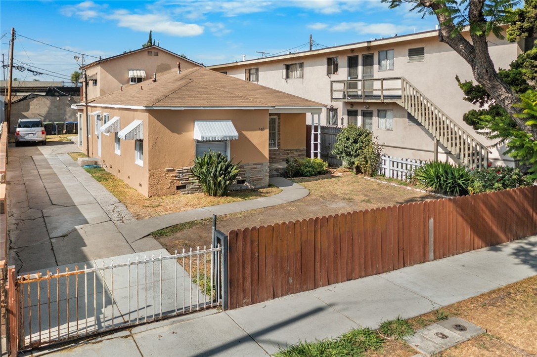 This charming fixer-upper duplex in the vibrant Madison Park neighborhood offers great potential located on a tree-lined street just off Main Street. Unit 1 includes 2 bedrooms, 2 bathrooms, living room, kitchen, dining area, mud/laundry room, and a den. Unit 2 offers 1 bedroom, 1 bathroom, kitchen, living room, with its own private outdoor space. The property includes a spacious storage room with potential for a laundry area, home office, or creative workspace. There is 1 car garage, 1 carport, and a long driveway for tandem parking and conveniently comes with separate electric meters. Centrally located, just south of Downtown Santa Ana, it’s close to the Santa Ana Metrolink Station and multiple transit options. With a walking score of 85, these homes are only steps to grocery stores, pharmacies, coffee shops, restaurants, and daily conveniences along Main and Edinger; with the neighborhood park just a short walk away. Don’t miss this solid investment in one of Santa Ana’s most desirable neighborhoods.
