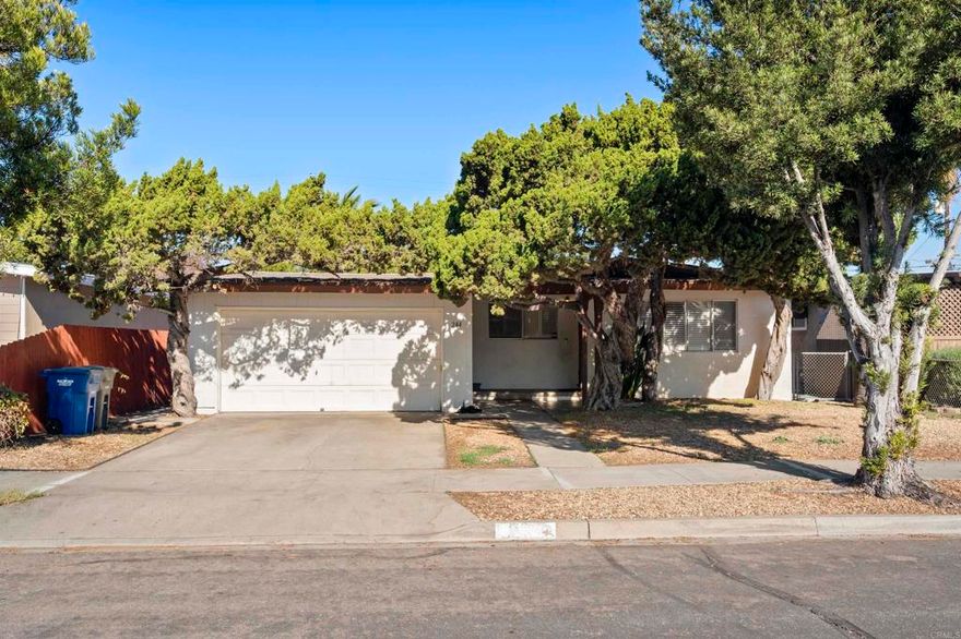 Designer Opportunity in a Prime West El Cajon Neighborhood  Bring your vision and personal style to this charming single-story West El Cajon home, offering 3 bedrooms, 1.5 baths, and approximately 1,455 sq ft of comfortable living space. Thoughtfully maintained over the years, the home features original hardwood floors, a functional open layout, and a generously sized kitchen with an extended dining area—perfect for entertaining, a game room, or creating a stylish bar and gathering space.  Set on a flat, usable lot, the backyard is ideal for hosting with an outdoor fireplace and plenty of room to relax, entertain, or expand your outdoor living dreams. While the home retains much of its original character, minor updates have been completed over time, leaving a fantastic canvas for cosmetic enhancements to truly make it your own.  Located in a highly desirable west-side El Cajon neighborhood near Avocado, this home is within walking distance to schools, parks, and shopping, offering everyday convenience with a strong sense of community.  A rare opportunity to own a piece of San Diego while it’s still affordable—perfect for buyers looking to add value, personalize, and enjoy long-term appreciation in a well-established neighborhood.