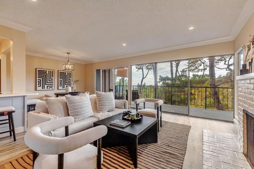 Welcome to 31 Del Mesa Carmel, a rare E-Model retreat with Ocean Views. Discover your private sanctuary in the prestigious Del Mesa Carmel community, where peace, luxury, and panoramic ocean views come together in perfect harmony, making every day feel like a vacation. Step into the light-filled great room, where walls of glass blur the line between indoors and out, immersing you in the surrounding forest and distant ocean vistas. The gourmet kitchen featuring high-end appliances, with sleek countertops, and an open layout ideal for entertaining. It flows seamlessly into the inviting living room, complete with a cozy gas fireplace, custom built-in bookshelves, and a casual dining area. Step outside onto the wrap-around deck to enjoy dramatic sunsets and whispering coastal breezes. Inside, radiant heated luxury vinyl flooring adds warmth and elegance, while both bedrooms offer serene forest views and exceptional privacy. Living at Del Mesa Carmel means more than just a beautiful homeits a lifestyle. Voted the #1 retirement community on the Monterey Peninsula, residents enjoy access to Woodys award-winning restaurant, a well-stocked library, guarded gate, resort-style amenities including a pool, spa, fitness center, lawn bowling, and vibrant social activities.