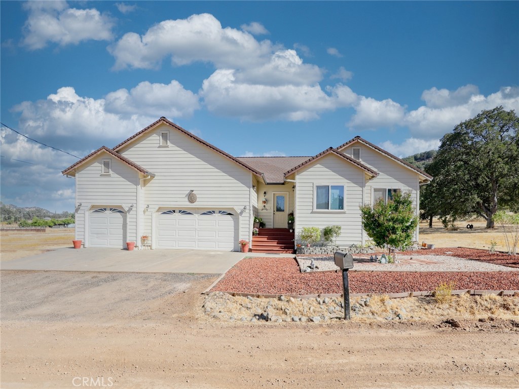 Nestled in a serene, open-space area of Clearlake, this beautifully maintained custom-built 2006 home offers the perfect blend of comfort, privacy, and breathtaking scenery. With an open-concept design, the living room, dining area, and kitchen flow seamlessly together, creating a warm and inviting atmosphere. Large windows fill the space with natural light while showcasing stunning views of rolling hills and vibrant sunsets.
The spacious kitchen is a cook’s delight, featuring ample cabinetry, a walk-in pantry, and an adjacent laundry room for added convenience. The generously sized primary suite boasts high ceilings, a ceiling fan, a walk-in closet, and direct access to the backyard deck. The en-suite bathroom is a luxurious retreat, fully tiled with a soaking tub, dual sinks, and a separate shower.
Two additional bedrooms share a well-appointed bathroom and are thoughtfully positioned along the hallway for privacy. Step outside to enjoy the private backyard deck, accessible from both the living room and the primary bedroom, perfect for relaxing or entertaining. The fully fenced yard is a low-maintenance area that provides space for a garden. ( The pool has been removed) A spacious 3-car garage offers plenty of storage, with a an electrical connection for a connected generator. The neighboring lots are available for purchase separately, offering even more possibilities.
Tucked away on a private access road, this home delivers a peaceful retreat-like setting while still being conveniently located. If you're looking for privacy, stunning views, and a well-designed home, this one is a must-see!
You said: