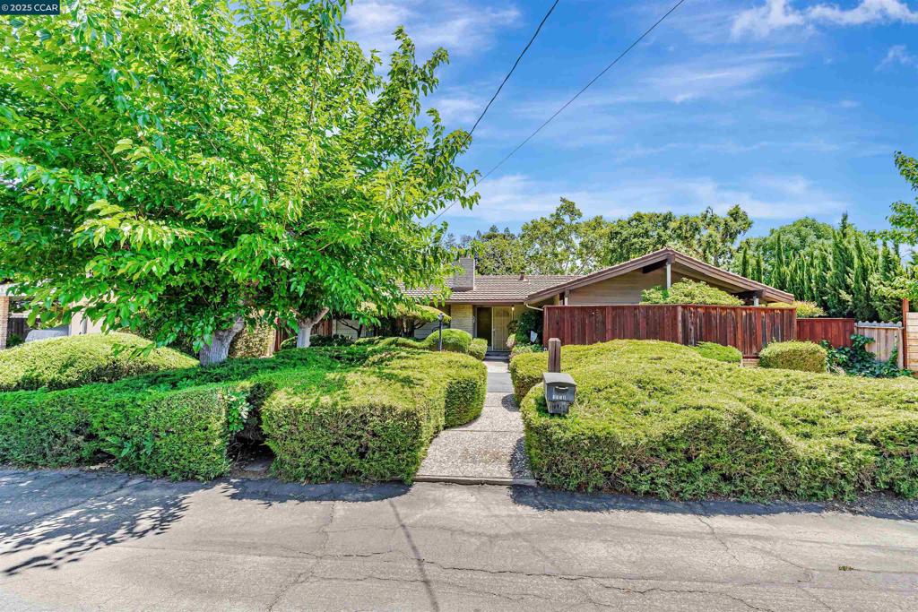 First time on the market since 1979! This is a rare opportunity to restore and personalize a well-loved single-story home on a generous .46-acre lot. With timeless charm and incredible potential, this property is ready to be reimagined into the dream home you’ve been waiting for. Inside, you’ll find 3 bedrooms and 2 bathrooms, along with two spacious living rooms—one featuring exposed wood beam ceilings that add warmth and character. A large sunroom offers even more space for relaxing, entertaining, or creating the perfect indoor-outdoor retreat. A U-shaped driveway provides easy access and curb appeal. The property also boasts two separate detached garages totaling 4 covered parking spaces, offering excellent potential to convert one into an ADU while retaining a 2-car garage. With additional RV and boat parking and a wonderful location, this property checks all the boxes for lifestyle, flexibility, and long-term value. A rare chance to revive a classic and craft a standout showpiece full of character, charm, and endless potential.