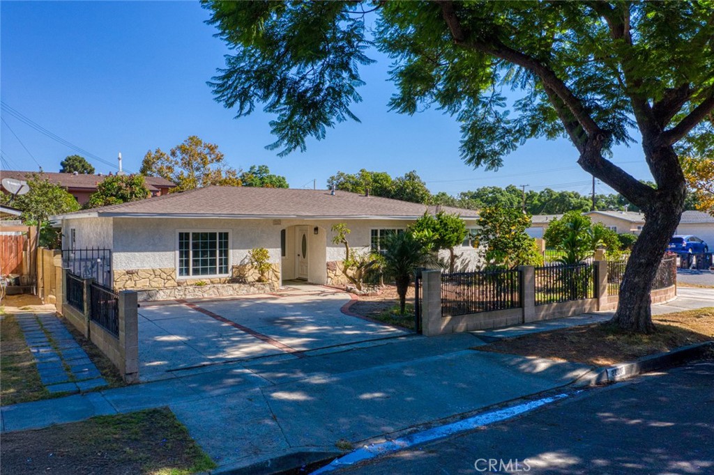 Beautifully remodeled single-story home in the desirable New Horizons neighborhood of Santa Ana. This spacious residence offers 5 bedrooms, 2.5 bathrooms, and 1,622 sq ft of living space on a large 7,062 sq ft corner lot. Recent upgrades include brand-new central air and heating, plus fresh interior and exterior paint for a modern, move-in ready feel. Enjoy a large private patio, perfect for outdoor entertaining and family gatherings. The property also features a unique dual-driveway setup and a 500 sq ft detached garage with excellent potential for conversion to an ADU, workshop, or guest suite. Built in 1958, this home combines mid-century charm with today’s updates, offering both comfort and investment opportunity. Conveniently located near schools, shopping, dining, and freeway access.