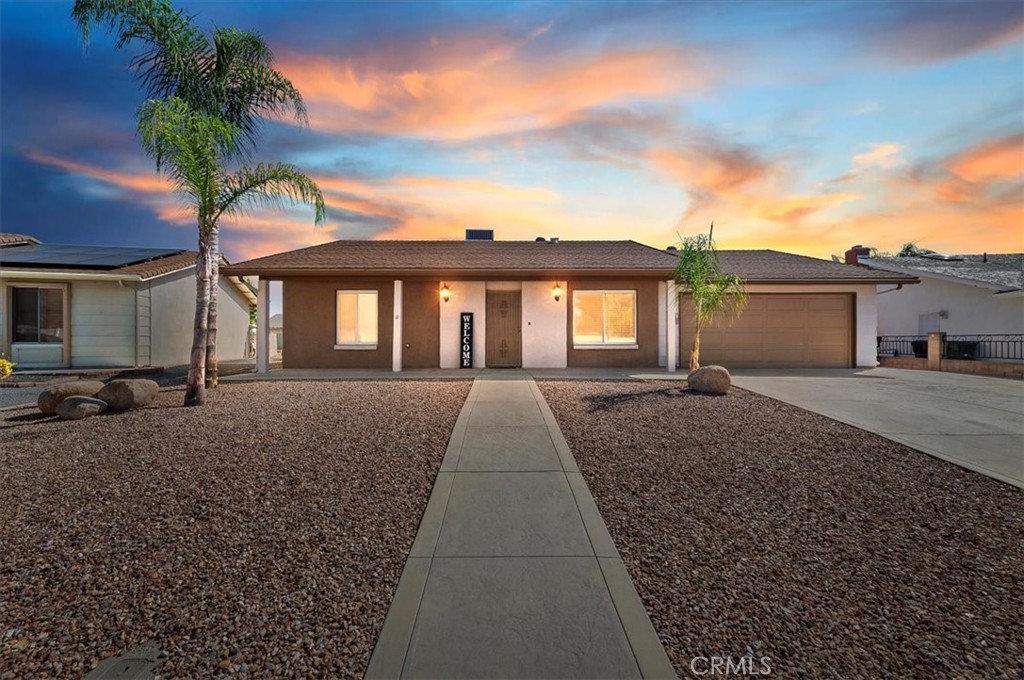 ***BEAUTIFULLY UPGRADED HOME in 55+ COMMUNITY in MENIFEE*** This Immaculate Home has 2 Large Bedrooms, 2 Baths, 2 Car Garage, 1328 Sq. Ft. with an additional separate Enclosed Room (200 Sq. Ft) off the main Family Room making this home much larger and a Whole House Fan throughout. Upon entering there is a formal Living Room leading to a Beautiful Kitchen with Countertop Seating, Upgraded white cabinetry, Granite Countertops overlooking the huge Family Room and Large Backyard. The Bonus Room is off the family room and is perfect for a dining room, pool table, craft or second family room. This bonus room has vents and a slider leading to the backyard and door to the garage. The Primary Bedroom is very spacious with two huge mirror sliding Closets, Vanity, private Remodeled Bathroom with Walk-In tile Shower and views of the Backyard. The second bedroom has a large Walk-In Closet and a door leading to the second Remodeled Bathroom with Walk-In Shower. The Backyard has lots of privacy trees and tons of room to build anything you can Dream up. The Community has many activities including, Pool, Spa, Clubhouse, Golf Course & Low Tax Rate.