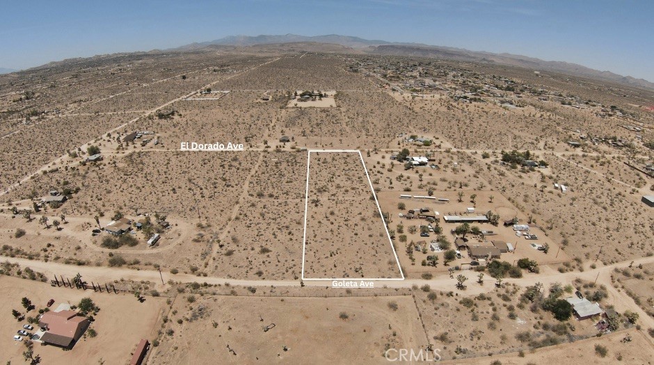 2.5 Acres in Prime Yucca Mesa – Utilities at the Street! Welcome to your next opportunity in the highly desirable Yucca Mesa area of Yucca Valley. This flat, 2.5-acre parcel sits in a peaceful, well-established neighborhood and offers both water and power in the street—a rare and valuable find in the Hi-Desert. Framed by stunning mountain views, the property delivers breathtaking sunrises to the east and vibrant sunsets to the west, making it a dream location for your desert retreat, custom home, or investment build. A standout feature? The lot borders both Goleta Ave and El Dorado Ave, offering dual street access for added convenience, flexibility, and future development potential. Located just 5 minutes from Yucca Mesa Elementary and about 10 minutes from both Downtown Yucca Valley and Joshua Tree, you're perfectly positioned for quiet desert living with easy access to local amenities and outdoor adventure.
Note: Address used is fictitious and intended solely to help locate the property more accurately.
Buyer to verify all utility access, zoning, and build-ability with the appropriate agencies. All lot lines shown or referenced are approximate.
Whether you're ready to build now or looking to secure a smart investment for the future, this parcel is ready for your vision.