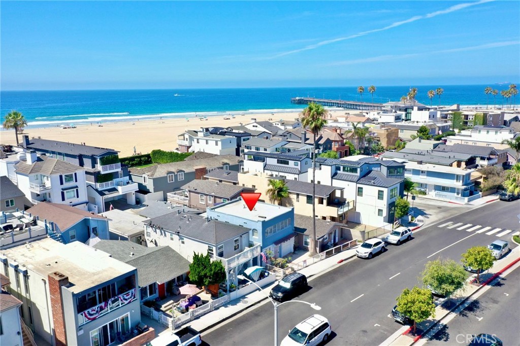 Legal non-conforming triplex with active short-term rental permits—just steps from the surf and sand. This rare investment opportunity features a 2-bedroom/1-bath and two 1-bedroom/1-bath units, each with its own washer and dryer. All residences have been stylishly upgraded with new kitchens, bathrooms, flooring, plumbing, and roof, and are move-in ready whether used as rentals or personal retreat. Parking includes a one-car garage plus two additional spaces. With no streets to cross to reach the beach and the pier, park, and bay only a block away, the location offers unbeatable convenience and lifestyle appeal.