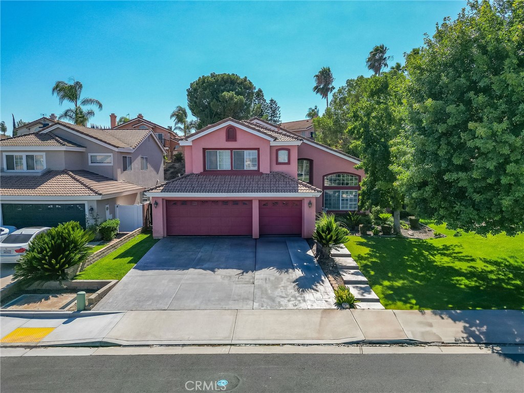 Situated in a highly desired area of Orangecrest in Riverside, this home offers some amazing features and a great foundation for you to come in and make it your own! Upon entering, the space opens up to two-story ceilings with a grand staircase cascading before you. The room is filled with loads of natural light from the numerous windows throughout. Beautiful wood laminate floors extend through most of the home, providing a rich homey feeling. The formal living and dining rooms are a welcoming retreat while the family room is a cozy place to hang out by the fireplace while sitting adjacent to the large kitchen. The natural tones of the kitchen make it easy to match with anyone's decor, while the glass front cabinets and stainless steel appliances give an upgraded look. And don't forget about the walk-in pantry, counter seating at the island, and the kitchen nook that offer views into the backyard. Lastly downstairs, there is a spacious bedroom and full bath, as well as the laundry room with extra storage space. Once upstairs, the double doors lead into a large master suite. With vaulted ceilings and open crevices, the space is very airy and inviting. The master offers both a standard mirrored closet as well as a spacious walk-in closet, while the master bath has dual sinks, a vanity area, and separate shower and soaking tub. Down the hall there are two additional bedrooms as well as a bonus room that can be used as a loft, hobby space, office, or an extra bedroom. Outside, the large patio cover provides lots of space for seating and dining and the BBQ island is the perfect addition for entertaining. With a little TLC and some great ideas, this backyard can become the dream you desire. This home has great bones and a lot of potential. The sellers are extremely motivated so don't wait to come check it out!