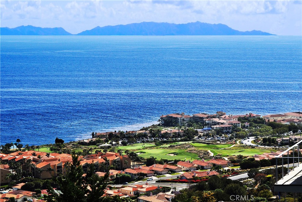 Located at a quiet cul-de-sac in the prestigious Monaco section of the country club area of Rancho Palos Verdes, this one-level home offers panoramic views of the ocean, mountains, beach, vineyard, both the Terranea and Trump golf courses, Catalina Island, coastlines, and beyond. Easy access to schools, banks, markets, restaurants, shopping, and walking trails. This home has three bedrooms, two large baths, a den with built-in bookcases, a formal dining and living room, a very open floor plan, and a covered balcony to relax and enjoy the endless views. Additionally, there is a bonus room with a separate entry at the lower level, which could be enjoyed for a play/hobby room or a guest quarter with its bath, and again with amazing views. This area is approximately 400 sq ft, which is not on the city/county records; therefore, it is not included in the square footage listed above. There is a voluntary Monaco HOA fee of $150, due annually, to cover the upkeep of the four entrance marquis, lighting, water, and gardening, ensuring a beautiful community. This is a fabulous property. Do not miss it!