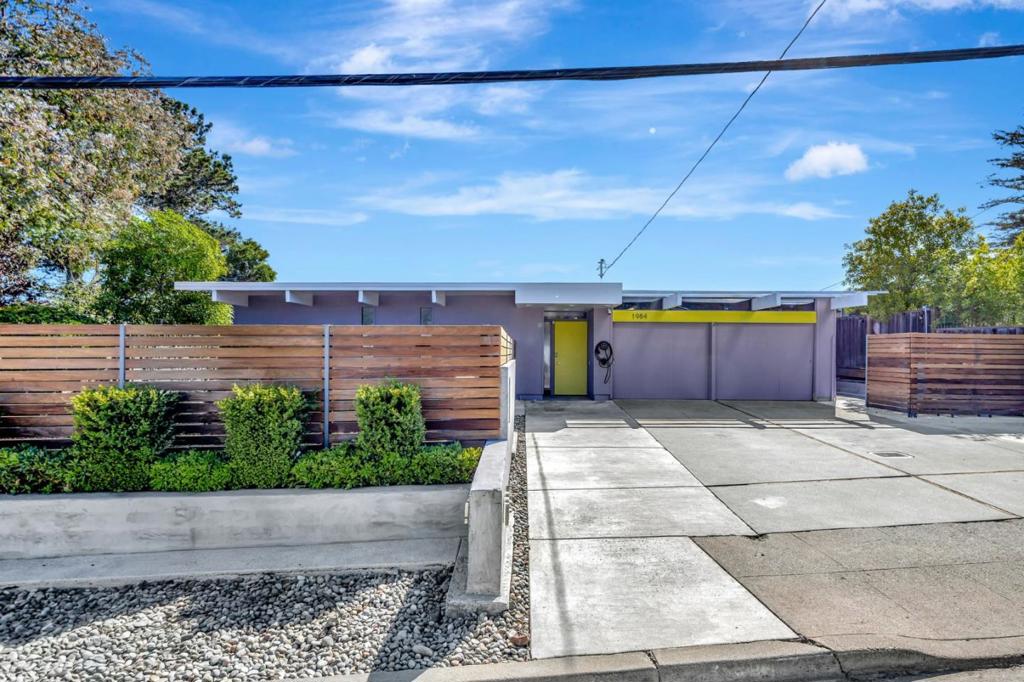 Welcome to the San Mateo Highlands Sleek Modern Mid-century Eichler home! Four-bedroom, Two-bathroom plus highly desirable atrium floor plan. Spanning a comfortable 1,710 square feet, this property offers an open concept living space with radiant floor heating and additional heating/AC zones for ideal temperature control. The modern kitchen is equipped with quartz countertops, a built-in oven, self-cleaning features, and energy-efficient Stainless steel appliances including dishwasher and microwave. Skylights in the dining area and kitchen add natural light to the interiors. The home's flooring is a mix of elegant hardwood and tile, complemented by the warmth of a fireplace in the dining area. Views of the coastal mountains is a plus on this private 8,130 sq foot mostly level lot which includes, a spa/hot tub and sauna, enhancing your relaxation experience plus two gazebos and two decks. Cumaru wood is used on the primary deck. With double-pane windows and solar power features, this home is a blend of comfort and efficiency. Walking distance to the rec center w/community pool, tennis/pickle ball, after school programs, playground, & daycare. Close to Hwy 280 and 92 for easy commuting to Silicon valley jobs. 5 minutes to Sawyer Camp Road for biking, jogging, walking trails.