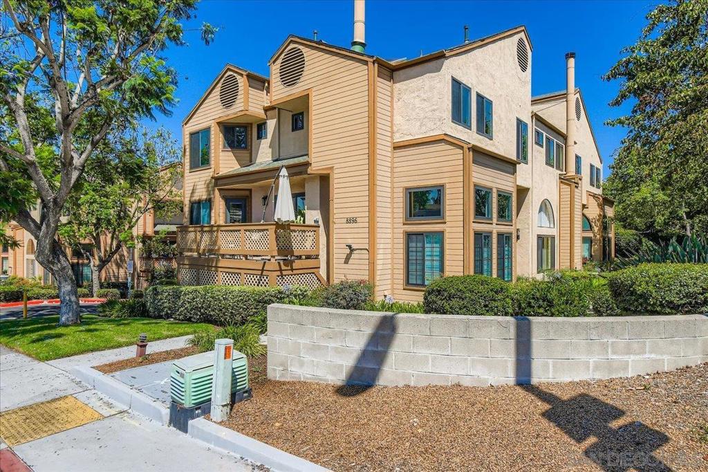 Welcome to this beautiful & spacious San Carlos townhouse (end unit) w/bright natural light, newer windows & fresh paint. High ceilings, cozy fireplace & vinyl flooring greet you as you enter. There is a private deck/balcony off the dining/kitchen area perfect for entertaining. The bedrooms are spacious & bright. The 2-car attached garage has ample storage space. The mature trees & beautiful park setting make this home a perfect sanctuary just far away from the City yet close to all San Diego has to offer. Come visit! This townhouse is perfectly positioned near Mission Trails Regional Park, Grossmont College, San Diego State University and the Grossmont Shopping Center with quick easy access to the 125 freeway.