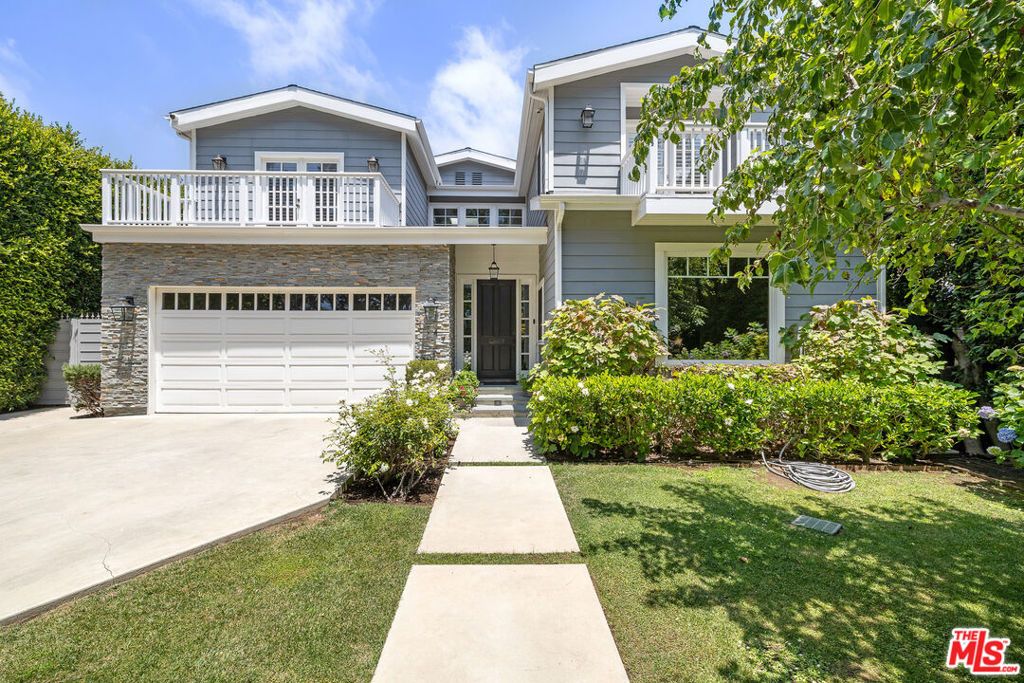 This exceptional custom-built Cape Cod traditional home offers outstanding privacy, timeless elegance, modern comfort, and custom designer finishes. The main level welcomes you with formal living and dining rooms that flow seamlessly into a spacious open-concept kitchen, an inviting family room, and additional breakfast/dining area or bonus office space. The chef's kitchen is equipped with premium appliances, custom cabinetry, honed marble countertops, an oversized walk-in pantry, and a large center island perfect for gathering and entertaining. Also on this floor: a beautiful bedroom with en-suite bath overlooking the pool, a stylish powder room, and direct access to a two-car garage with electric car charging capability. French doors open to the expansive backyard, creating a seamless indoor-outdoor lifestyle. Privacy hedges enclose the professionally landscaped outdoor space, which includes a saltwater pool, spa, and patio. Upstairs, the luxurious primary suite features multiple oversized closets, custom built-in bookshelves, a spa-like bathroom with a large shower and soaking tub, and an oversized private balcony. Two additional en-suite bedrooms and a dedicated laundry room complete the upper level. Ideally situated just south of the Brentwood Country Club and moments from the Brentwood Farmers Market, close proximity to top-rated schools, shops, dining, and the beach, this home truly represents the best of Santa Monica living.
