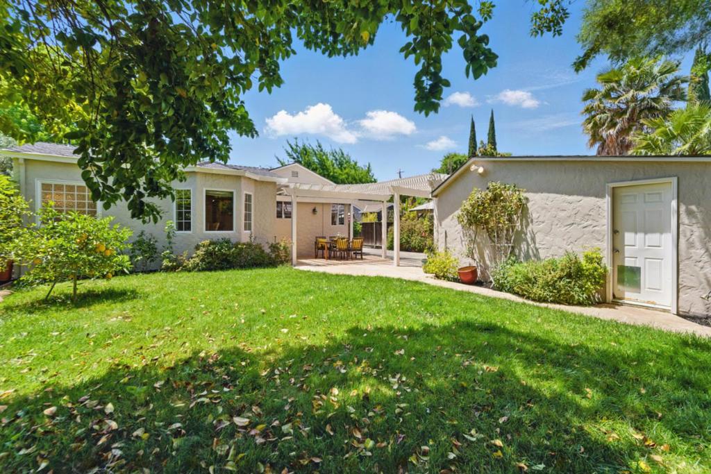 Welcome to 1344 Iris Court, a charming bungalow tucked on a quiet cul-de-sac in the heart of Willow Glen. Just a short stroll to the Avenue, youll love the shops, dining, and community spirit. This home blends 1940s character with thoughtful updates, featuring a spacious living room with built-ins, gas fireplace, hardwood floors, crown molding, and a large picture window. The kitchen offers abundant cabinetry, granite counters, gas appliances, and a sunny dining nook that flows to the backyard for easy entertaining. A 2006 addition created a generous primary suite with custom closets and spa-like bath. Two additional bedrooms share a bright hall bath. The private backyard includes a flagstone patio, pergola, and lush landscaping. Added highlights: central A/C, mudroom with laundry and half bath, detached garage with storage, and gated driveway. Close to top schools, freeways, Caltrain, and downtown San Jose.