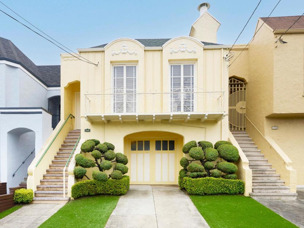 1st Time on Market! Charm & Character define this spacious sunlit 2 Bedroom 1 ½ Bath cherished 1 Owner home highlighted by gleaming newly refinished hardwood flooring & fresh paint throughout! A gracious parquet floored foyer welcomes you; the expansive living room also features an ornate fireplace & the formal dining room opens to a center patio. The skylit kitchen includes the original Wedgewood stove plus adjoining breakfast room with corner hutches. An interior stairway leads to a large knotty pine "Bonus Room", overlooking the delightful rear garden, plus ½ bath on the lower level. Expansive 1 car garage with open workshop area, double sink (space for washer & dryer), storage galore, + dark room. Wonderful location in sought after Outer Sunset close to Ocean Beach, Golden Gate Park, vibrant neighborhood shopping, schools, & transportation. Truly a Treasure!