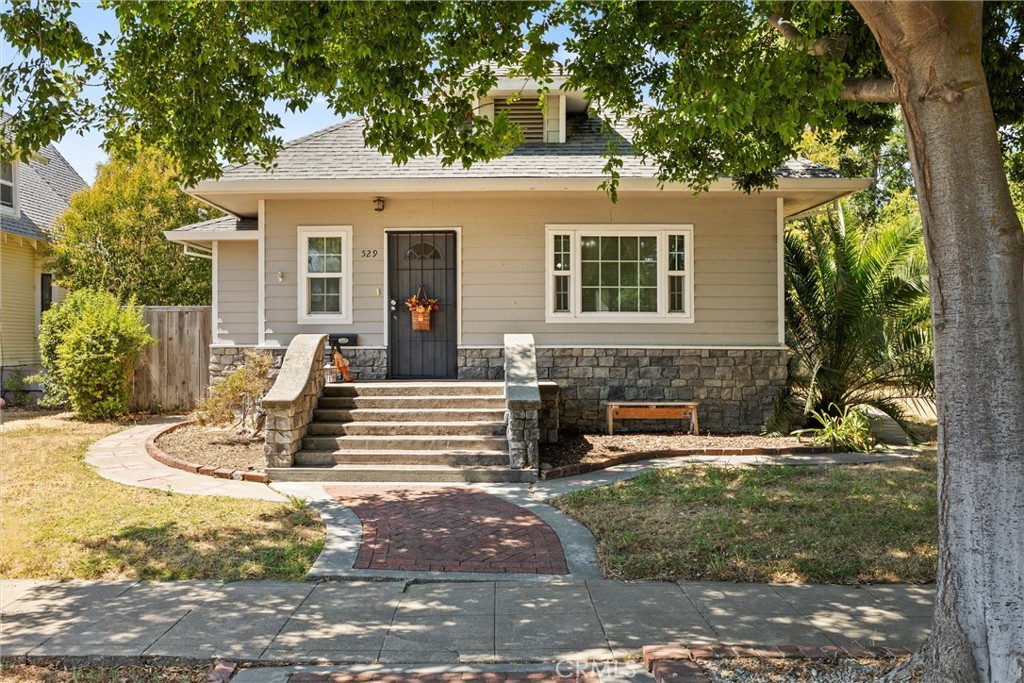 Don’t miss your chance to own this wonderful home filled with classic charm and character! Walk inside to wide open spaces. This property welcomes you with a foyer that leads into a spacious living and dining area highlighted with lots of windows bringing in the natural light. The high ceilings give this home that grand ambiance. Updates include fresh paint, new flooring, and a solar system with two backup batteries for energy efficiency that is a power purchase agreement that the buyer is to assume. The kitchen is a true standout, offering generous counter space with tile finishes, perfect for meal prep, along with an oversized walk-in pantry to keep all your kitchen essentials organized. There is a breakfast nook off the kitchen, which is perfect for enjoying that morning cup of coffee. The 2 bedrooms and 2 bathrooms are roomy and the bedrooms have nice closet space with extra storage. Central heating and air is present as well as, a whole house fan, to keep the home comfortable year-round. Step outside to a large backyard—ideal for gatherings, gardening, or creating your own private retreat. The detached garage is a great space that you access through the alley way, and the cement slab next to it is great for additional parking. This home is nestled in an established neighborhood close to schools, shopping, restaurants, and downtown amenities, this home truly has it all! Buyer to verify all information to their satisfaction.
