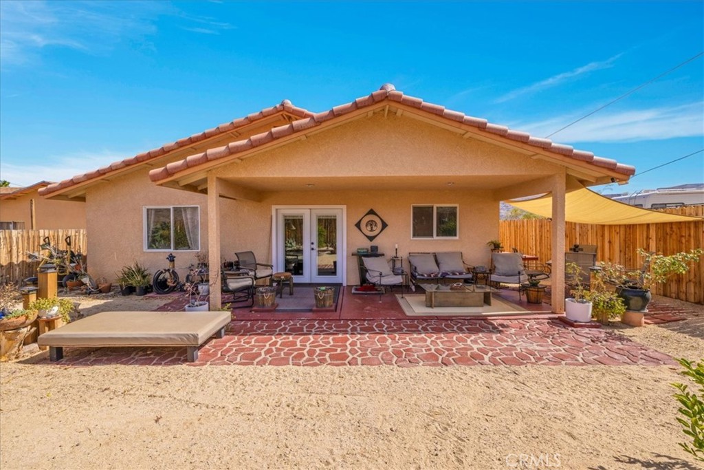 Welcome to this charming 3-bedroom, 2-bathroom tile home in the heart of 29 Palms! This residence has been cared for, boasting modern finishes and an inviting atmosphere. Enjoy the benefits of PAID SOLAR energy, providing sustainable living while reducing your utility costs. The fenced yard offers privacy and ample space for outdoor activities, perfect for pets or entertaining guests. With its convenient location and thoughtful upgrades, this home is a wonderful opportunity for comfortable desert living. Don't miss out on making it yours. This has an assumable VA loan with a rate of 2.75%, and seller is willing to help buyer with closing costs.