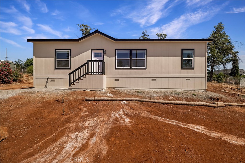 Discover comfort, style, and space in this brand new 3-bedroom, 2-bathroom manufactured home, offering 1,280 sq. ft. of thoughtfully designed open-concept living. Tucked away on a peaceful cul-de-sac, this home combines modern features with everyday functionality at a price that’s hard to beat. Step inside to a light-filled layout with seamless flow between the living, dining, and kitchen areas. The kitchen is a true highlight, boasting sleek stainless steel appliances, elegant black countertops, and an abundance of cabinet space. The primary suite features a private bathroom, dual sinks, walk-in shower, while two additional bedrooms and a second full bath offer flexibility for family, guests, or a home office. Outside, the large backyard provides a blank canvas for your personal touch; garden, play space, or outdoor entertaining, the choice is yours. Located in a quiet, established cul-de-sac, this home offers both privacy and convenience.