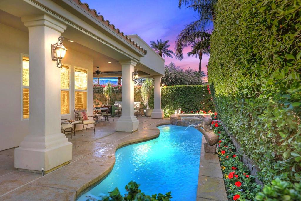 Gorgeous Tuscany inspired home built in 2005 on prime corner lot in fabulous, gated community of Montelena in the heart of Indian Wells. Beautiful home boasts 2991 square feet, high ceilings, neutral tiled floors, plantation shutters, 3 Bedrooms, 3 ensuite Baths, Powder bath, spacious formal and informal Dining room, plus Home Office. Elegant gated and pavered front Courtyard with impressive Rotunda entry. Stunning open Great Room awaits with granite fireplace and mirrored wet bar with glass shelves and granite countertops. Outstanding Gourmet Kitchen adjoins featuring big island with bar seating, granite countertops, full stone backsplash and stove hood, high-end stainless appliances includes new dishwasher, wine cooler, and walk-in pantry. Home office and Primary Bedroom have new luxury vinyl wood floors which adds such warmth to the home. Large Primary Bath has travertine countertops, dual sinks plus large vanity area, soak tub, big shower, and huge walk-in custom closet. Guest Bedrooms are carpeted and feature walk-in closets. The very private and lovely landscaped backyard has a large, covered patio highlighting the glistening pool/ spa and water features. Enjoy this remarkable home with special benefits and a private walkway to the Tommy Bahamas Miramonte hotel next door.