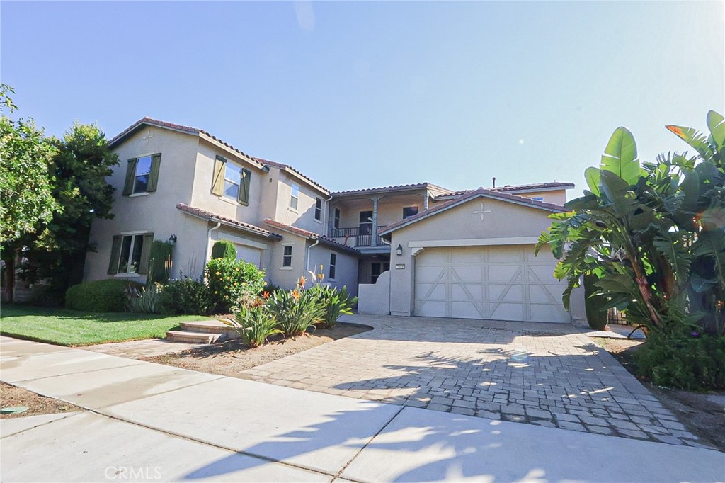 Step into modern luxury at 7618 Hertz Pl, where security, style, and flexibility come together in one extraordinary Eastvale residence. This stunning 5-bedroom, 4.5-bathroom home is tucked behind a private automatic driveway gate, offering peace of mind the moment you arrive. Inside, soaring ceilings and an open layout create a warm yet sophisticated atmosphere, anchored by a cozy fireplace in the living room. A private balcony invites you to soak in breathtaking hill and water views—your perfect spot for morning coffee or evening relaxation.
A rare highlight of this property is the attached separate dwelling with its own private entrance and garage access, ideal for multi-generational living, extended guests, or even rental income. Energy-efficient living is built in with a fully owned solar system, while central air and heat ensure year-round comfort. With an attached 2-car garage, flexible living spaces, and an unbeatable combination of privacy and luxury, this home is more than a place to live—it’s a lifestyle.