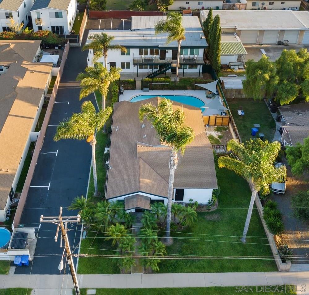 $275,000 Price Reduction! We are pleased to present 1147 Grove Avenue, a recently renovated six-unit property located in the charming family-friendly coastal community of Imperial Beach, San Diego's most southern beach town. This unique offering provides a phenomenal owner-user house hack opportunity with a large front house on Grove Avenue and five apartment units in the back. The property sits on a generous 20,129 square foot lot offering potential for construction of multiple ADU units making it an attractive investment for both owner-users and value-add investors. The property consists of six large fully renovated apartment units, three of which are furnished. There are (4) three-bedroom, one-bath units, (1) two-bedroom, one-and-a-half bath townhouse and (1) three bedroom, one-bath detached house at the front of the property. The extensive renovations completed in 2024 have modernized both the unit interiors and exterior of the property. The upgrades include hard surface countertops, new appliances, new cabinetry, vinyl plank flooring, air conditioning, exterior paint and stucco, a new roof, new electrical systems, and refinishing of the pool and pool area. Additionally, the parking lot has been re-slurried and striped, providing ample parking with a total of 12 surface spaces.